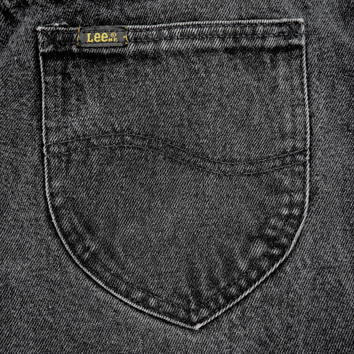 Close-up of a rear pocket on pair of 'Lee' black denim jeans.