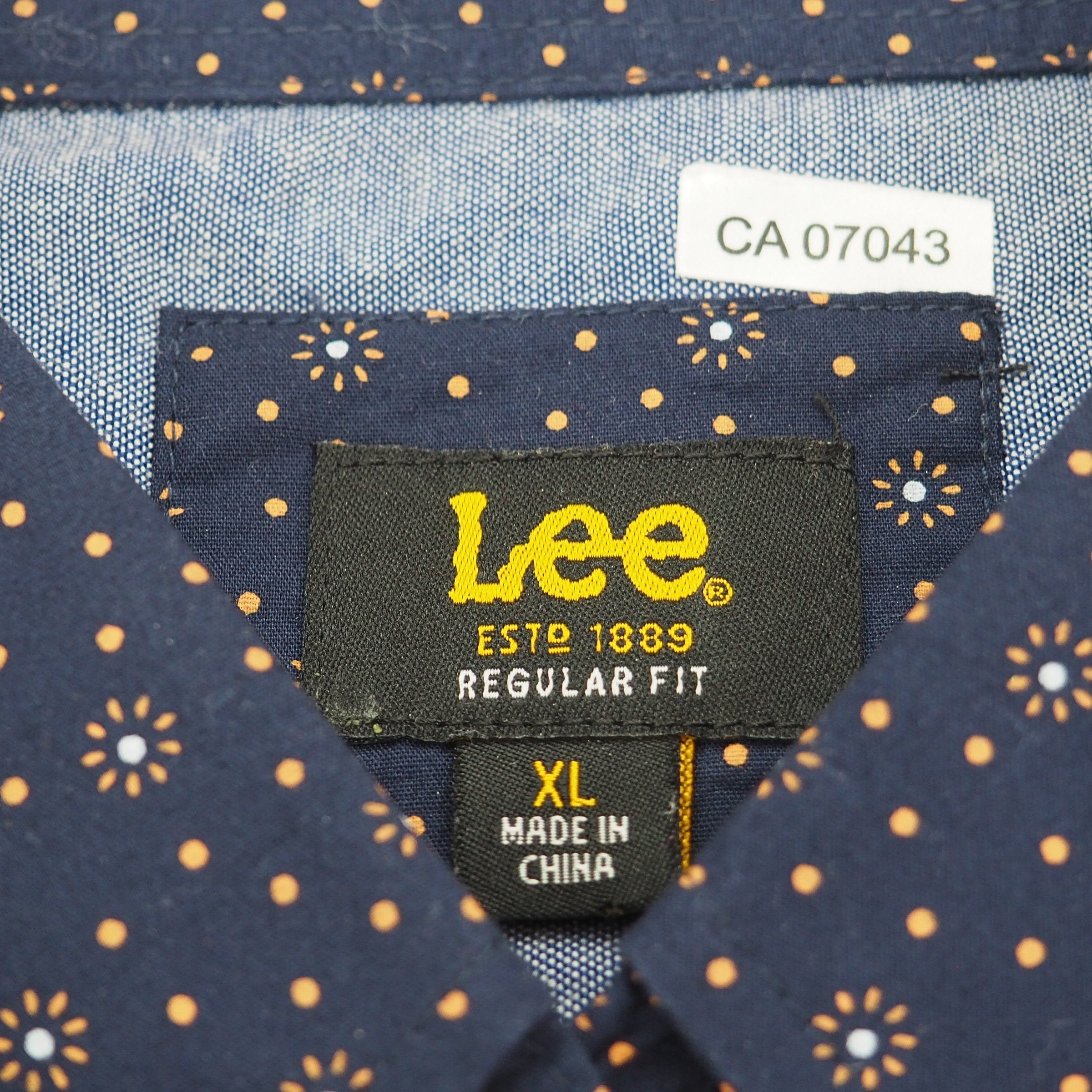 Lee brand label on a garment with patterned background