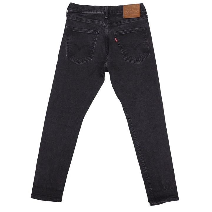 Black levis 512 jeans on a white background