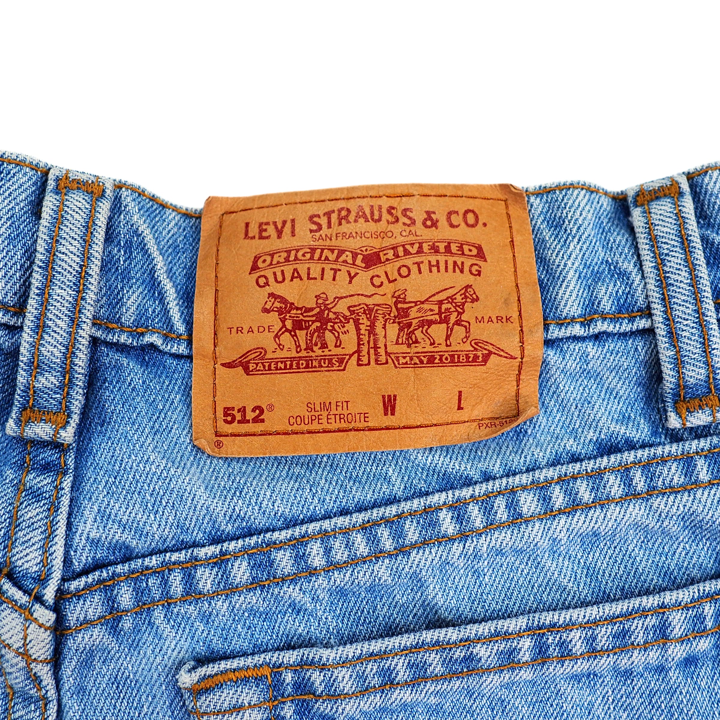 Levi's jeans waistband with a brown jarcon patch label on a white background