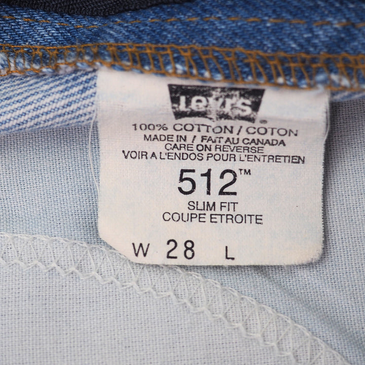 Levi's batwing care label on a pair of jeans with size and material information.