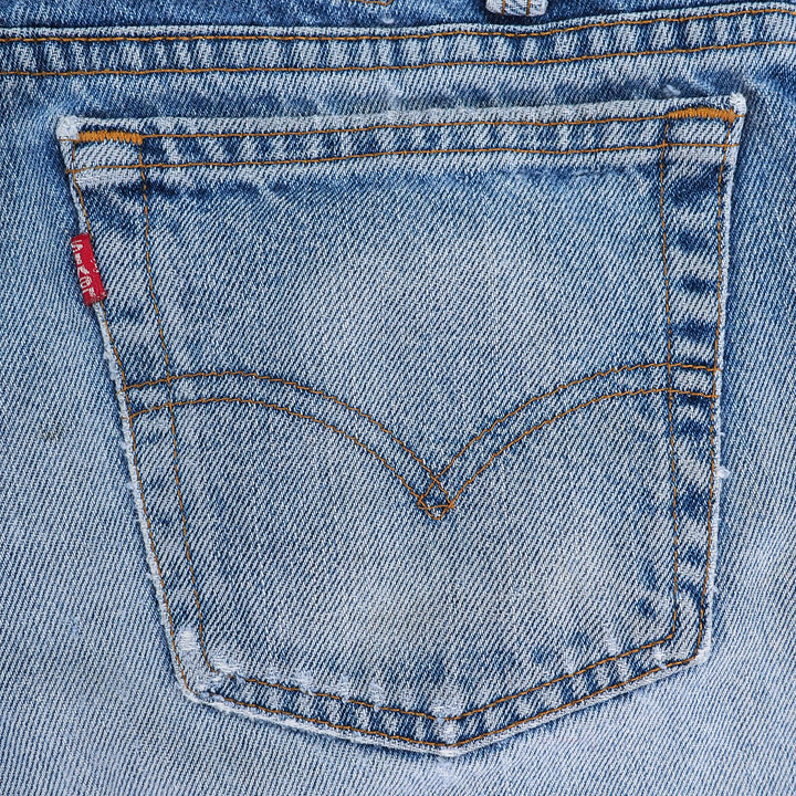 Close-up of a Levi's branded pocket on faded blue denim jeans