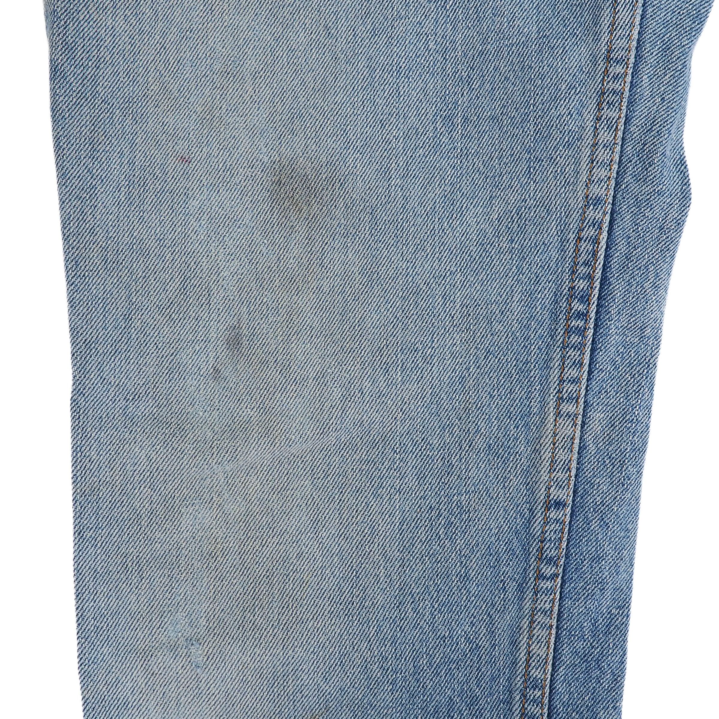 Close-up of light blue denim fabric with a white background