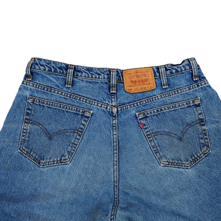 Back view of blue jeans with a Levi's label on a white background