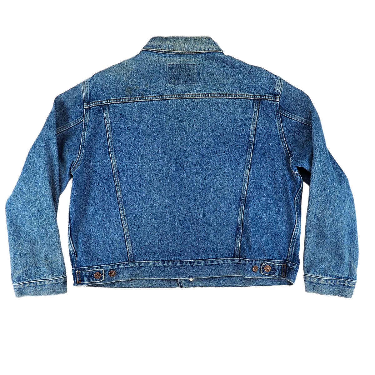 The back view of a classic blue denim jacket, laid flat against a solid white background.