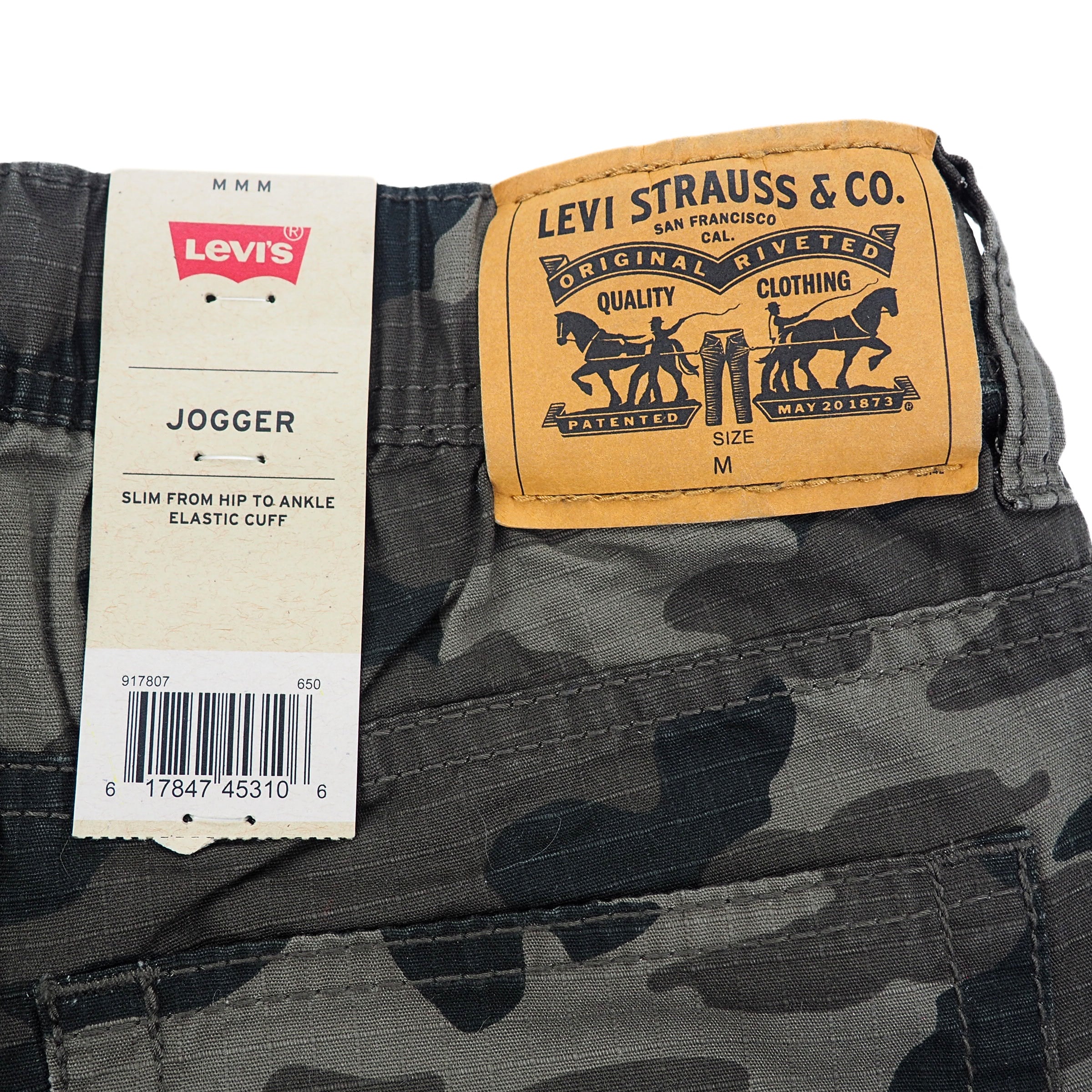 Camouflage pants with Levi's and Levi Strauss & Co. labels on a white background