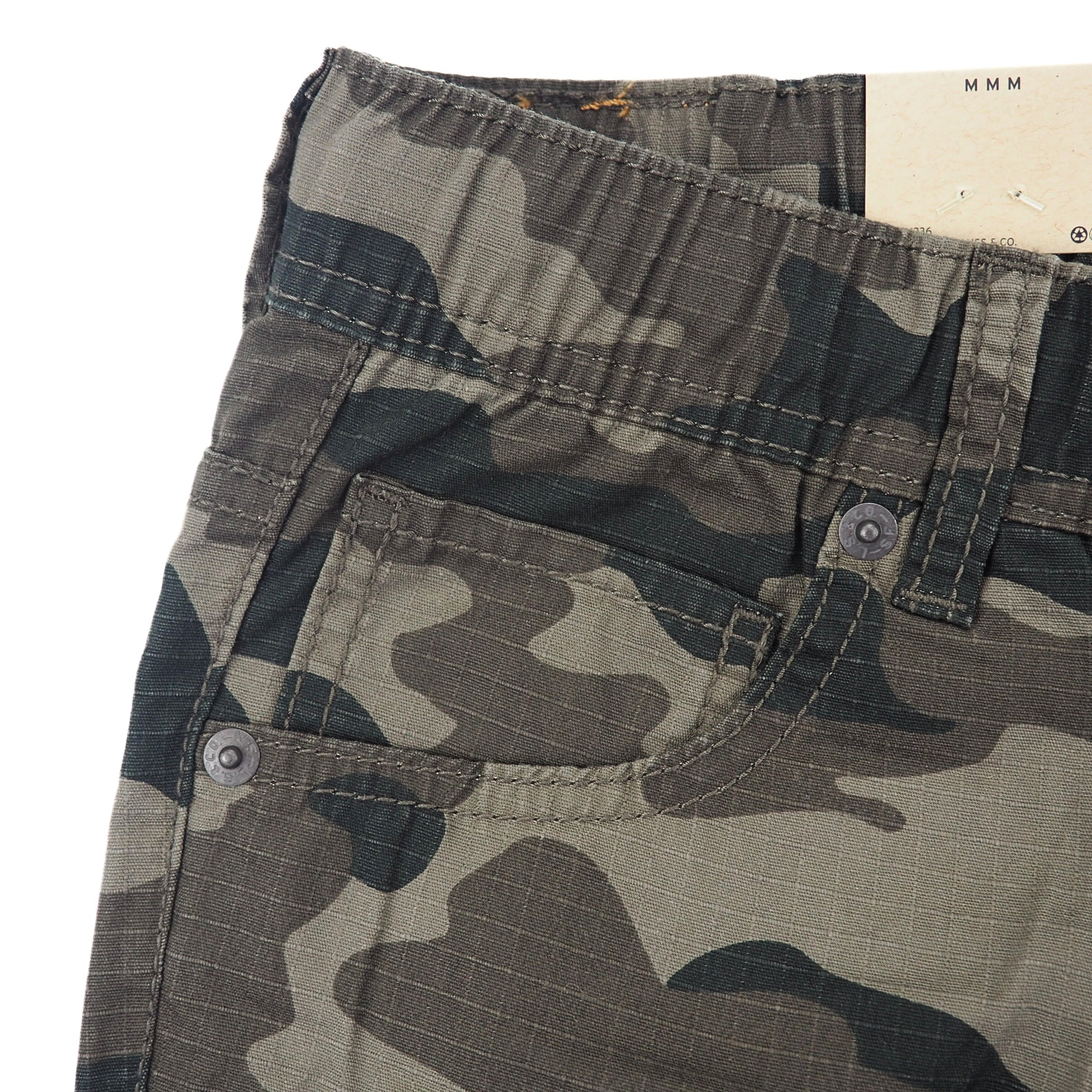Camouflage pants with rivet details on a white background