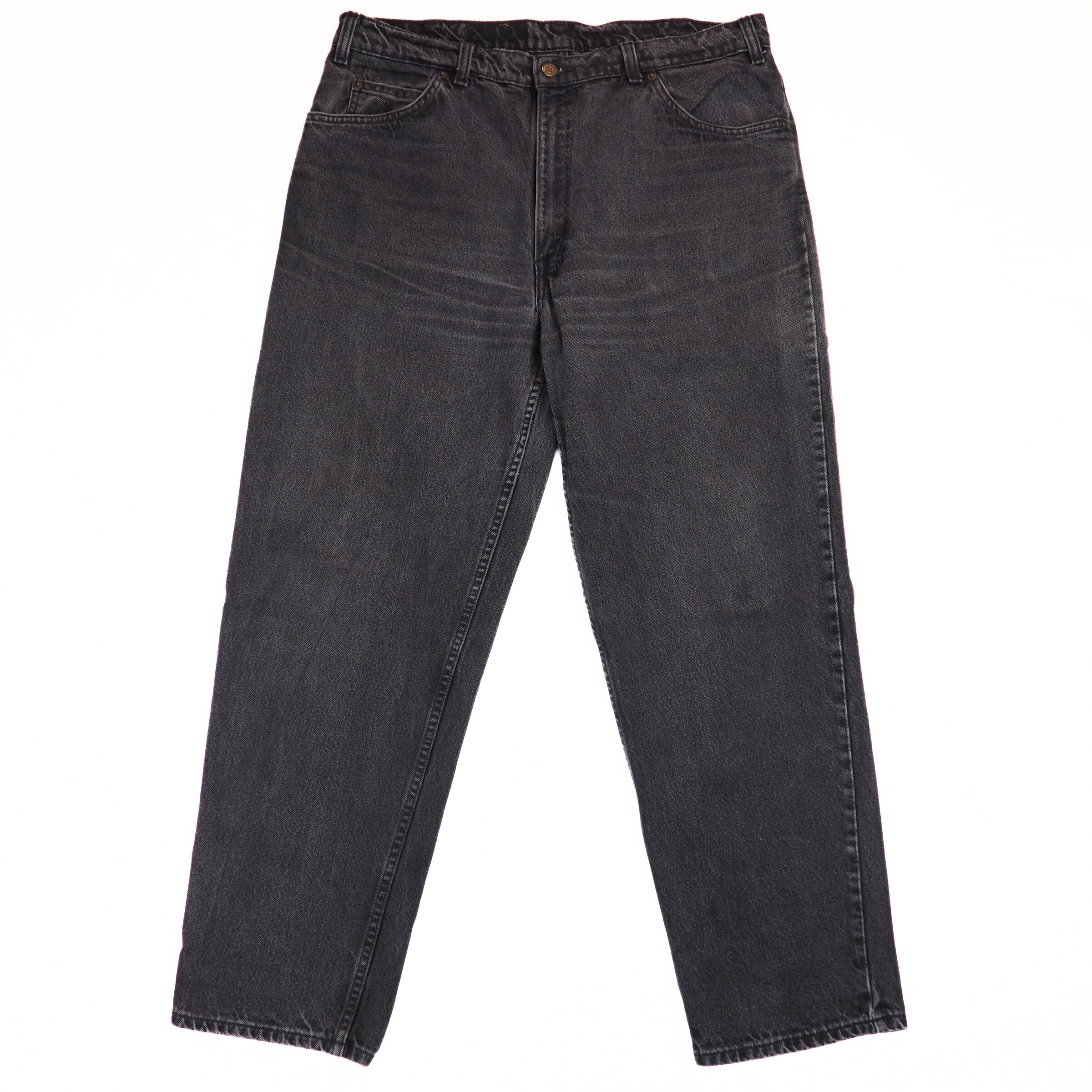 Pair of black jeans on a white background