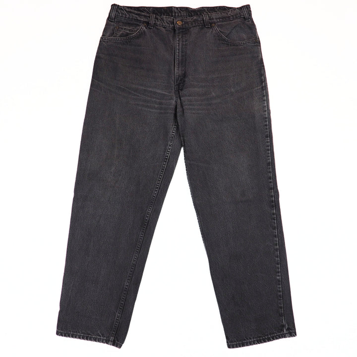 Pair of black jeans on a white background