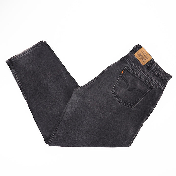 Pair of black Levi's jeans on a white background