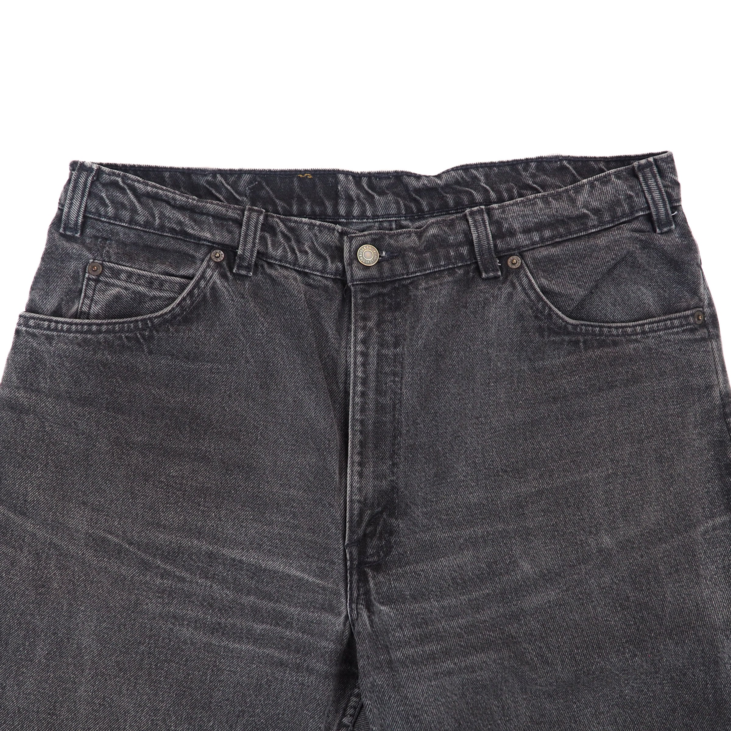 Close-up of a pair of gray jeans on a white background