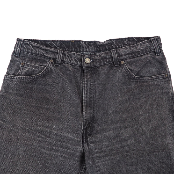 Close-up of a pair of gray jeans on a white background