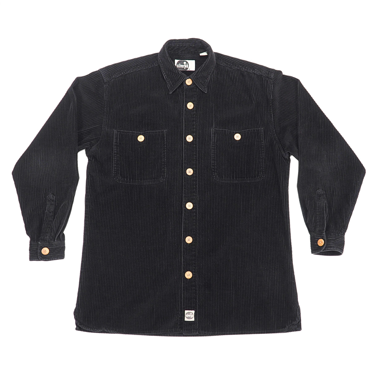 A black corduroy button-down shirt jacket with two chest pockets and light-colored buttons, laid flat against a white background.