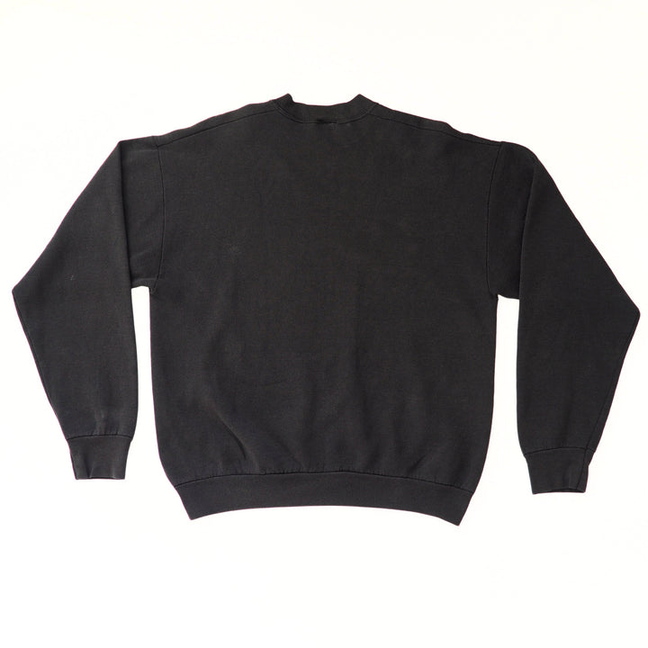 Back of a black sweatshirt on a white background