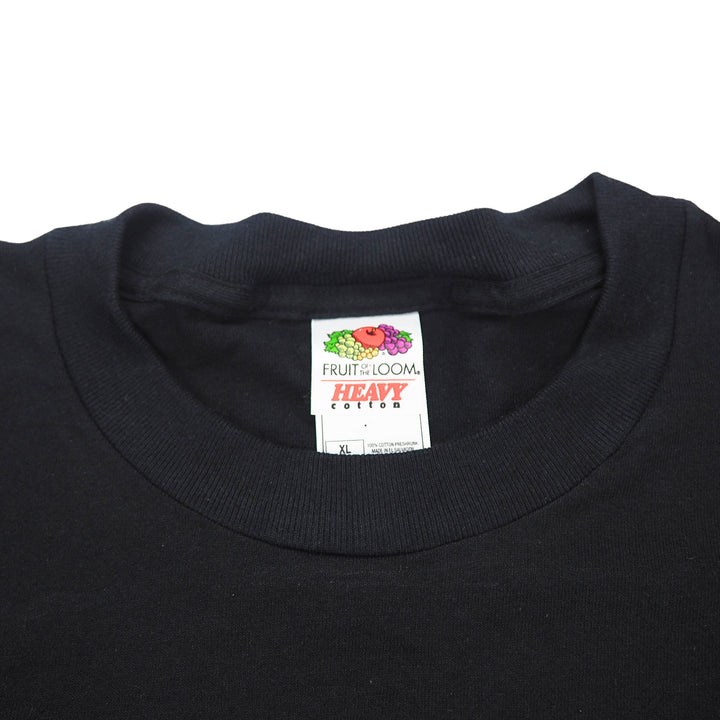 Black t-shirt collar with a visible Fruit of the Loom label on a white background