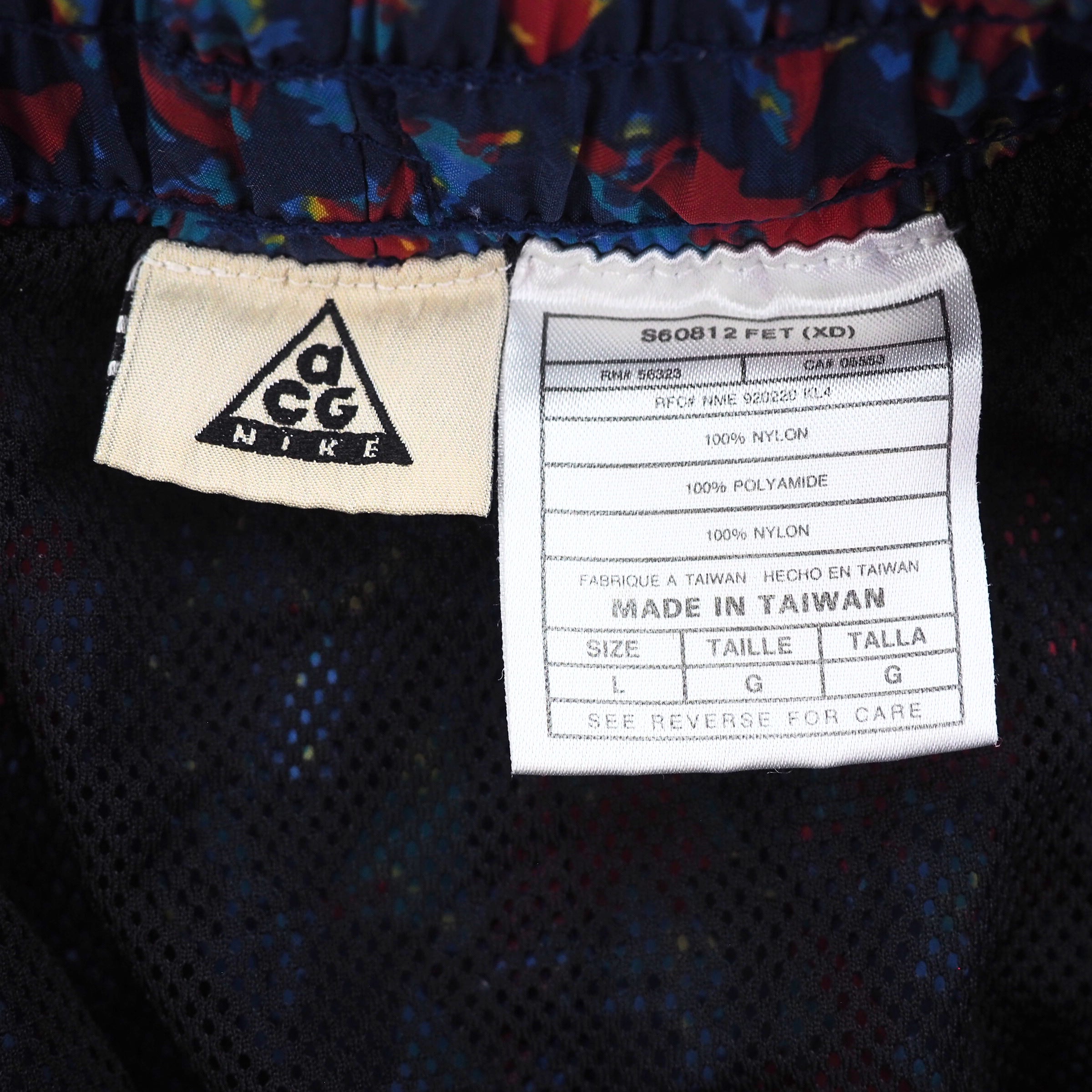Nike ACG label on a garment with multicolor pattern