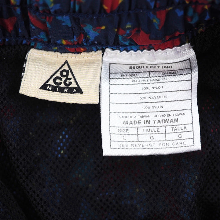 Nike ACG label on a garment with multicolor pattern
