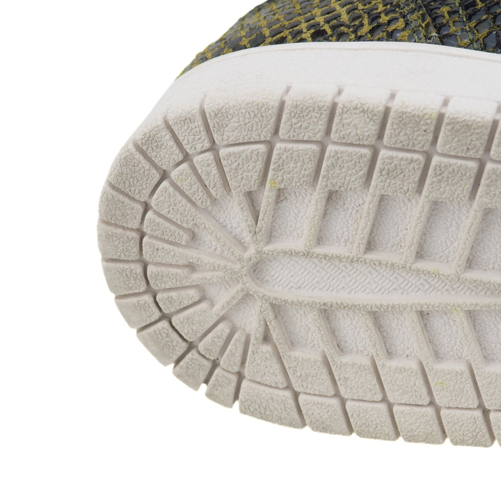 Close-up of a textured shoe sole on a white background