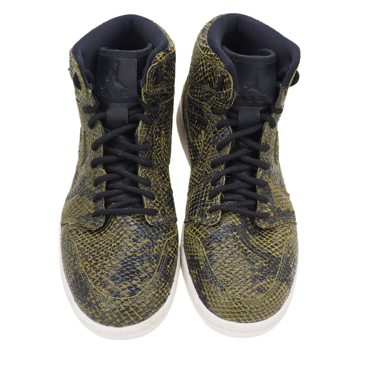 High-top sneakers with snake print and black laces on a white background