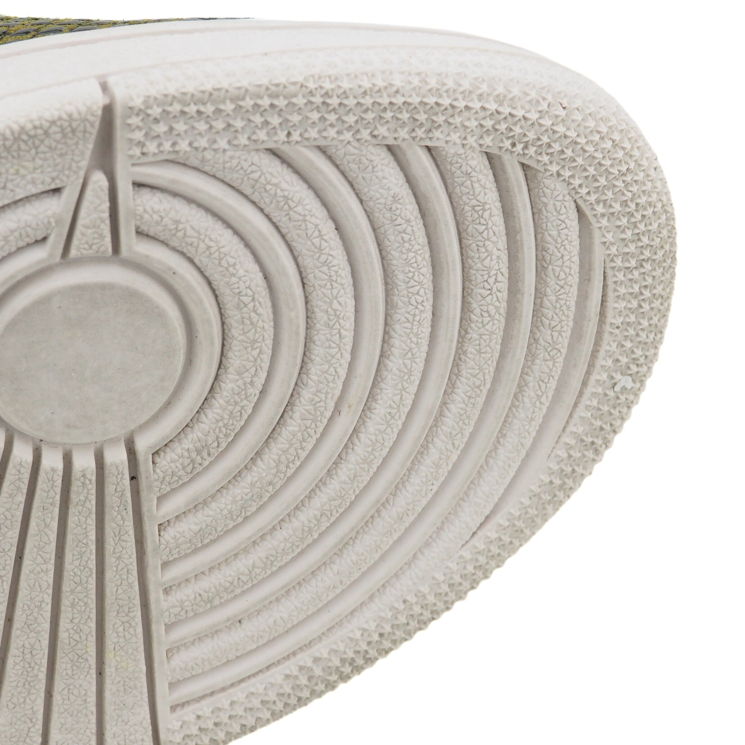 Close-up of a textured basketball shoe sole with stars and circular patterns