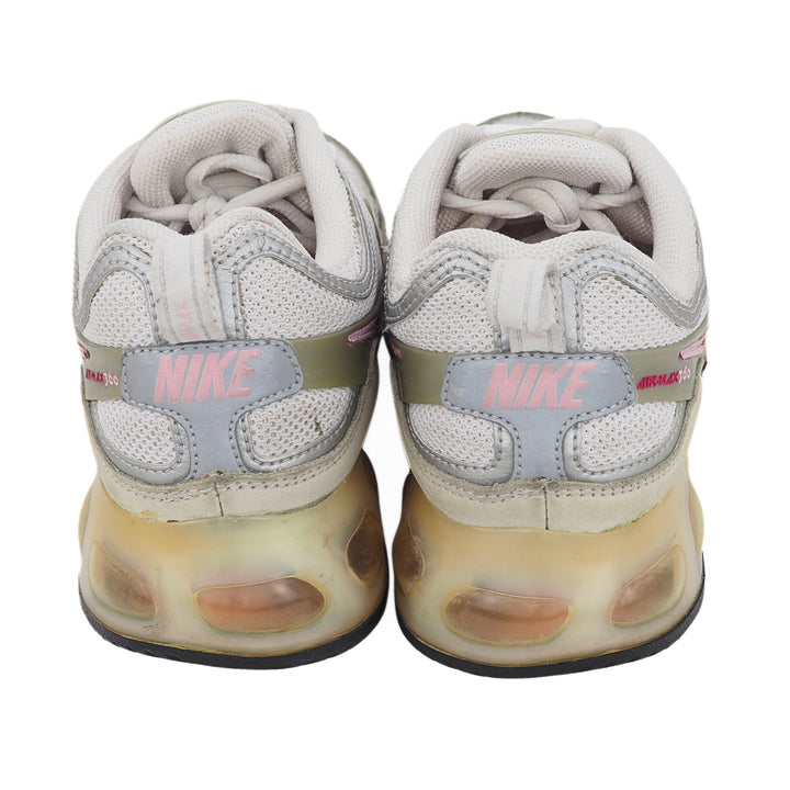 Pair of Nike sneakers with a unique air cushioned sole design on a white background