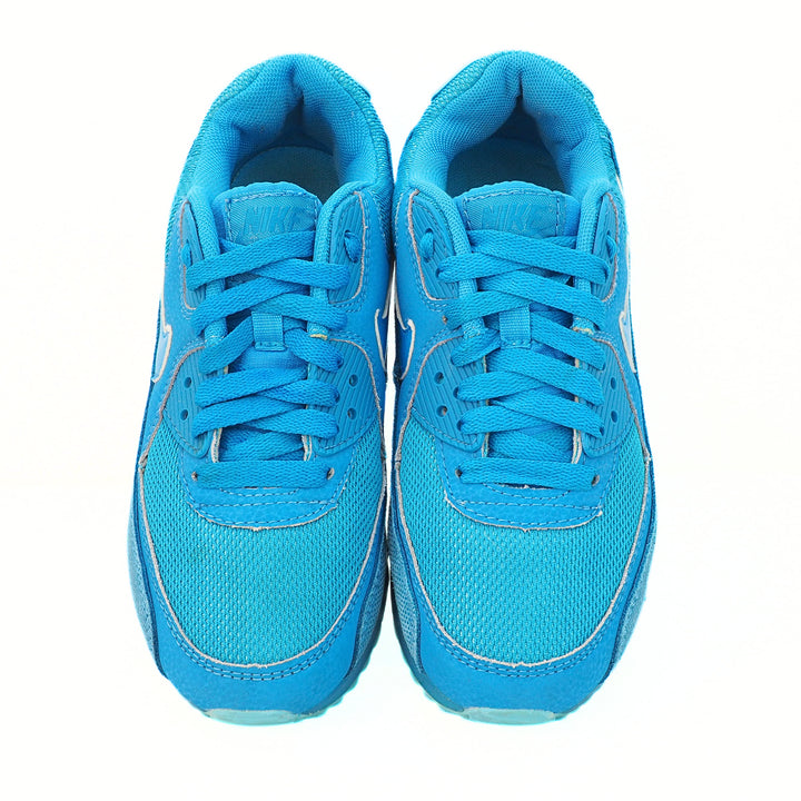 Pair of blue sneakers on a white background