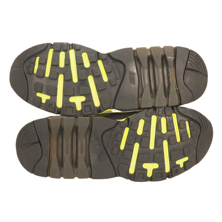 Black and yellow sole of a shoe on a white background