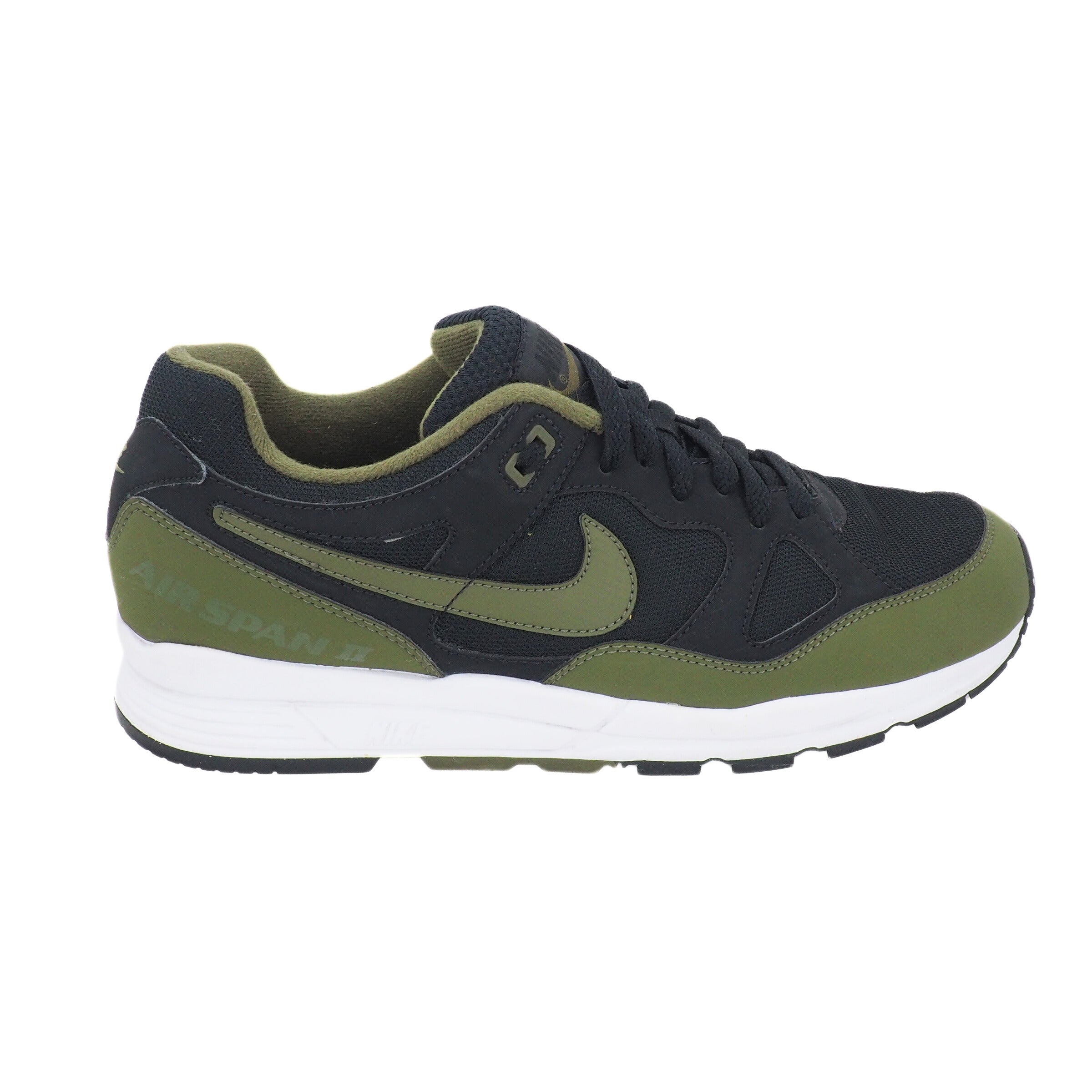 Black and green sneaker with Nike logo on a white background