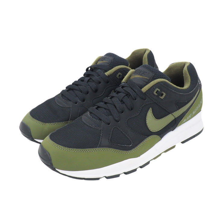 Pair of black and olive green Nike Air Span 2 sneakers on a white background