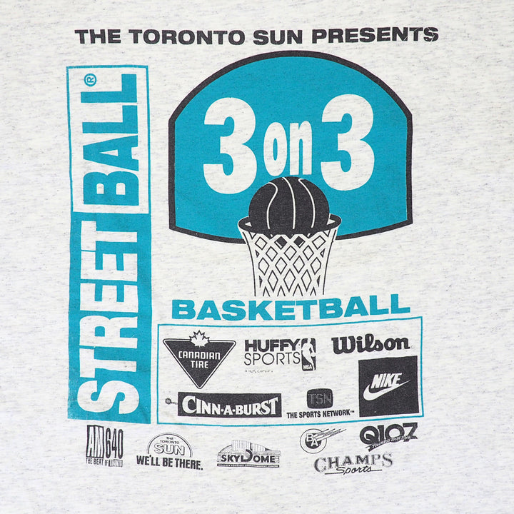 Close up of a graphic print containing multiple brand sponsor logos in teal and black