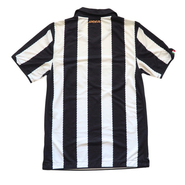 Back view of a black and white striped soccer jersey with 'Juventus' logo on a white background
