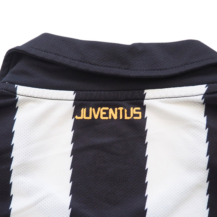 Close-up of the back collar of a black and white striped soccer jersey with 'Juventus' branding on a white background.