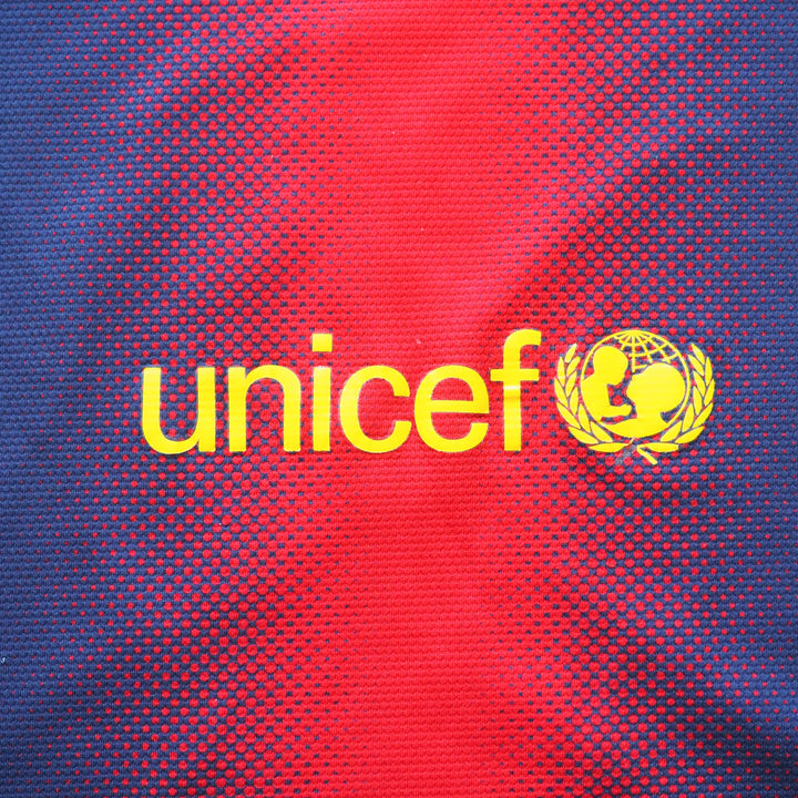 Yellow UNICEF logo on a red and blue patterned background