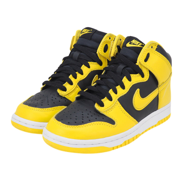 Black and yellow Nike Dunk sneakers on a white background