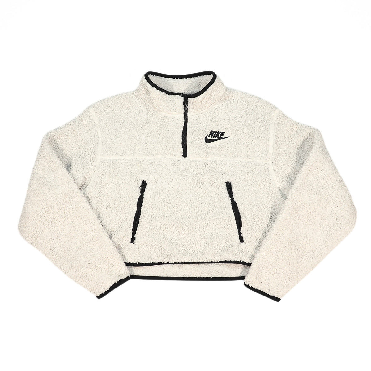 A cream-colored fleece pullover jacket with black trim, featuring a half-zip neckline, two front zip pockets, and a black Nike logo on the left chest, displayed on a solid white background.