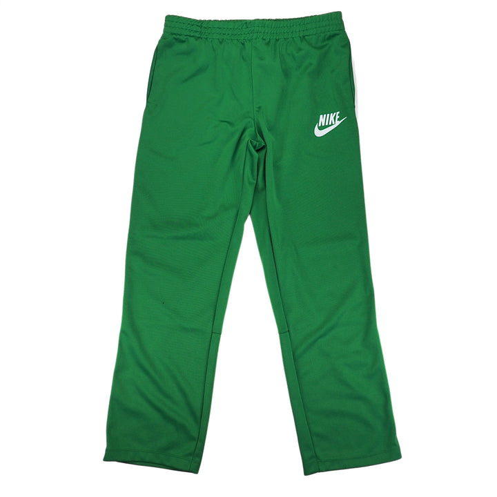 Green Nike track pants with white Nike logo on a white background