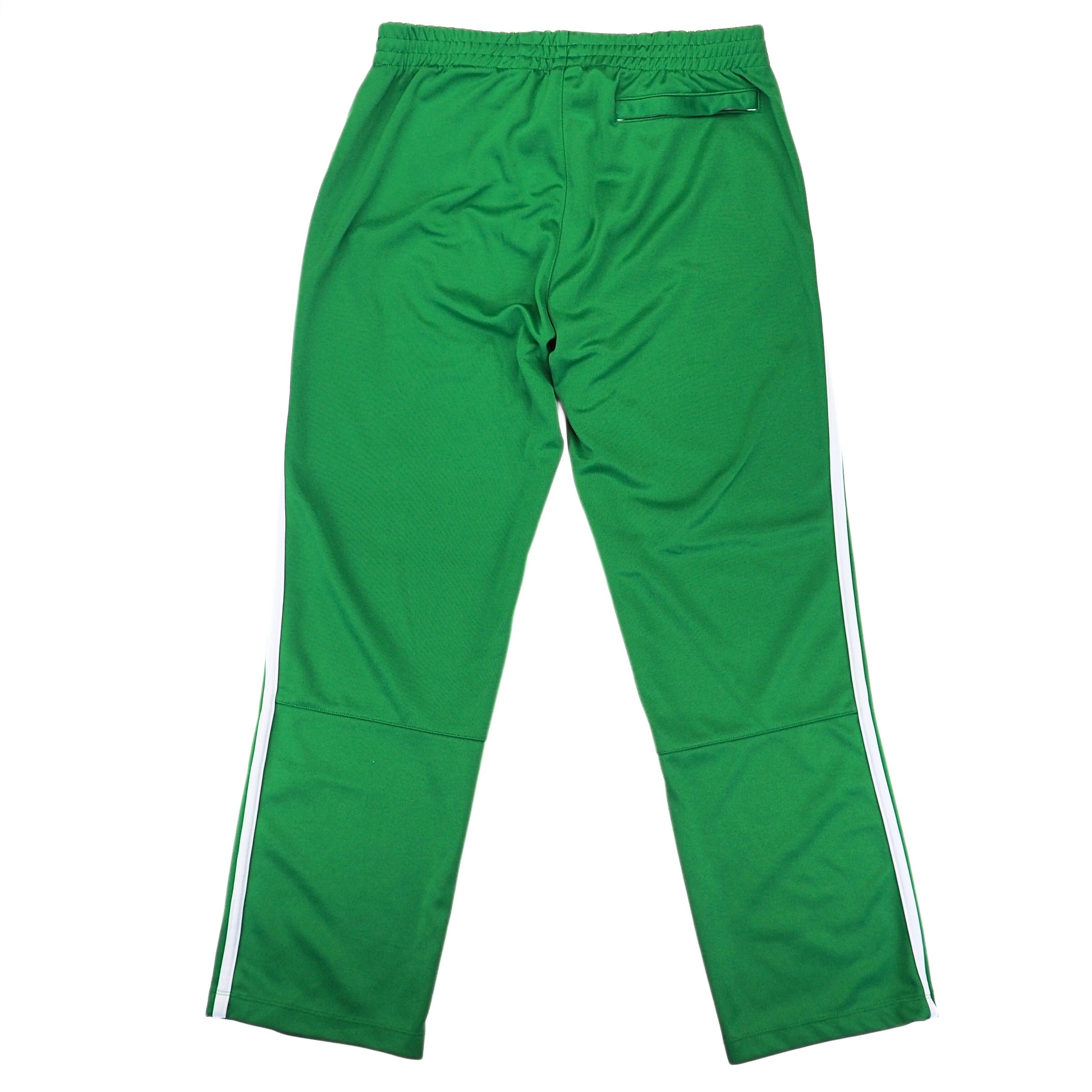 Back view of a pair of green Nike track pants on a white background