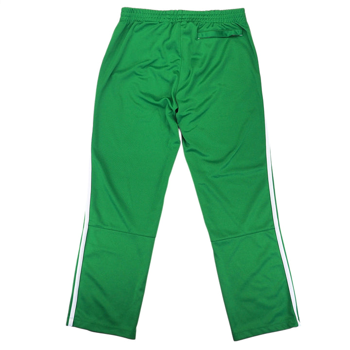 Back view of a pair of green Nike track pants on a white background