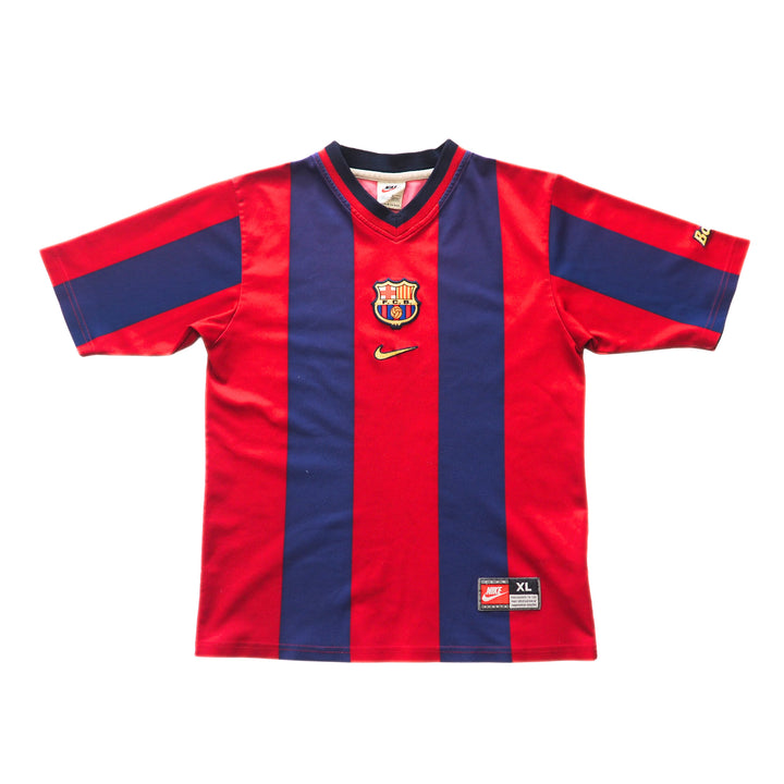 Red and blue striped FC Barcelona soccer jersey with a Nike logo and club badge on a white background