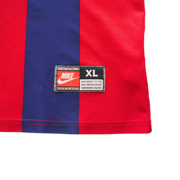Detail of a Nike Team Sports jock tag on the front of a vintage FC Barcelona soccer jersey