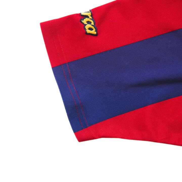 Close-up of a red and blue fabric with a brand logo on a white background