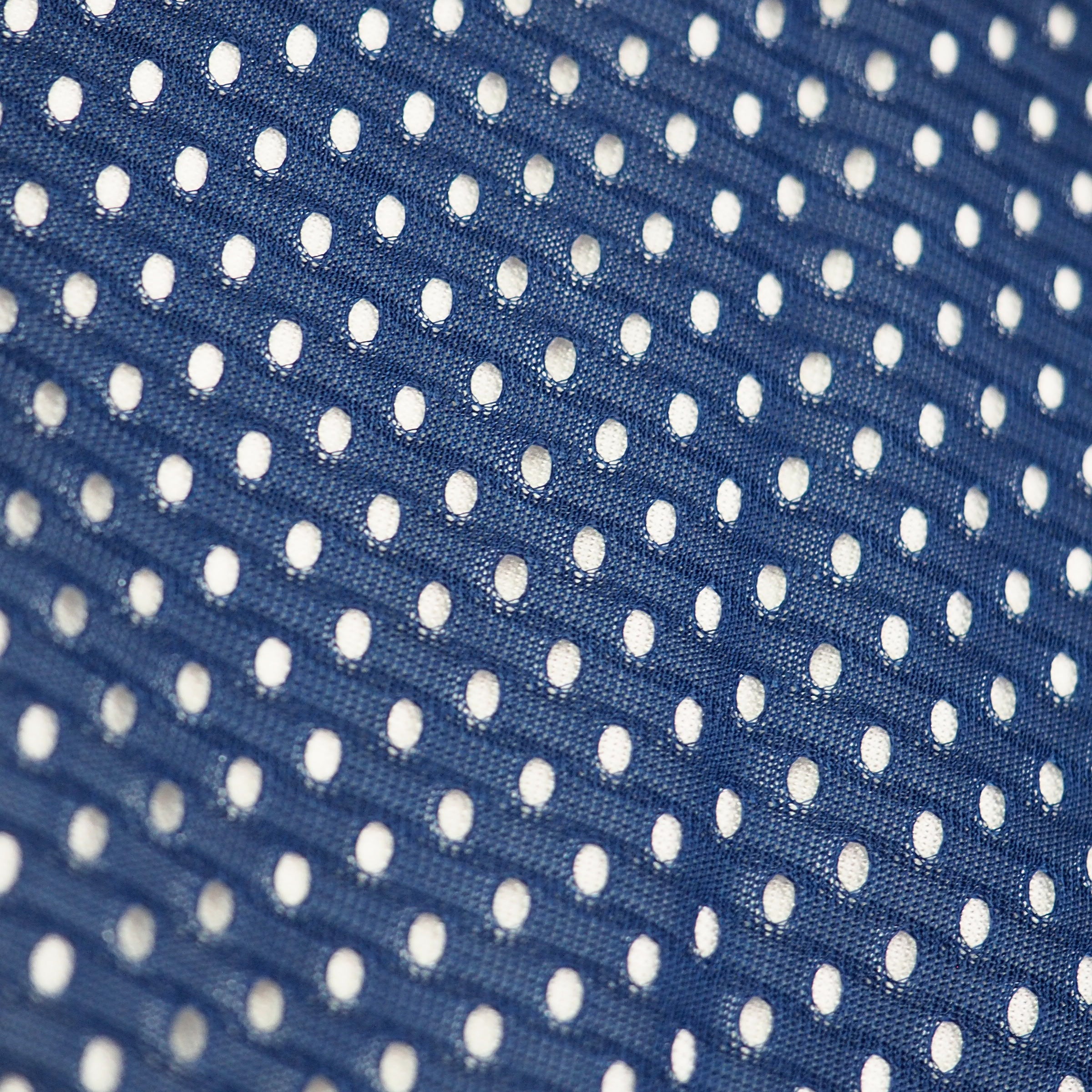 Close-up of blue mesh fabric of vintage 90s nike team sports team usa soccer jersey