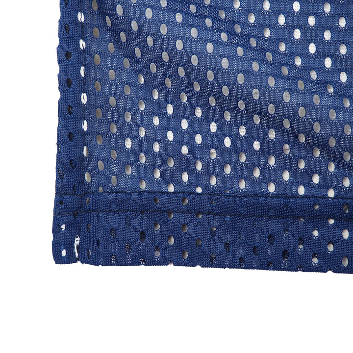 Close-up of blue mesh fabric on a vintage nike team sports team us jersey on a white background