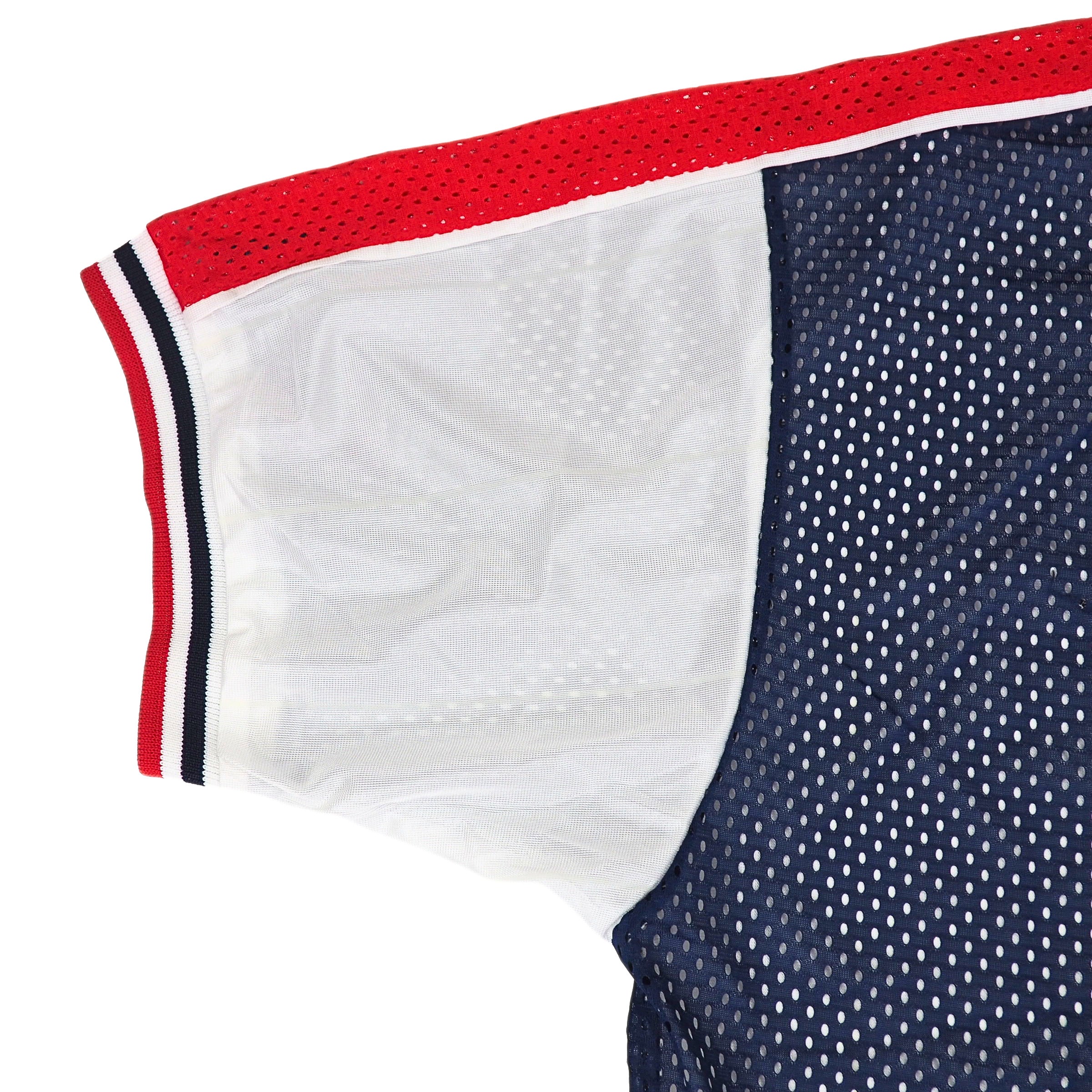 Close-up of a nike team sports team usa jersey with red, white, and blue trim on a white background