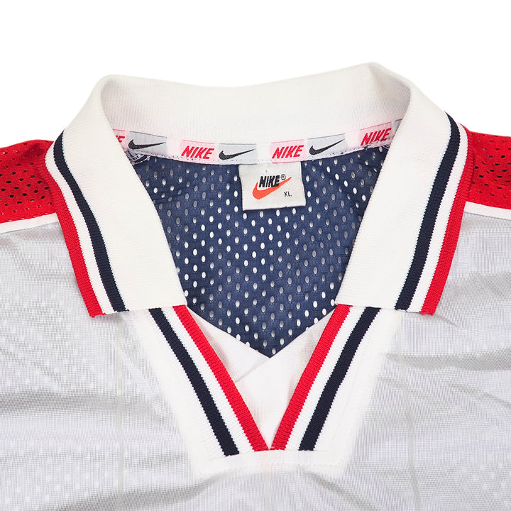 Close-up of a Nike Team Sports Team USA soccer jersey with red, white, and blue accents on a white background.