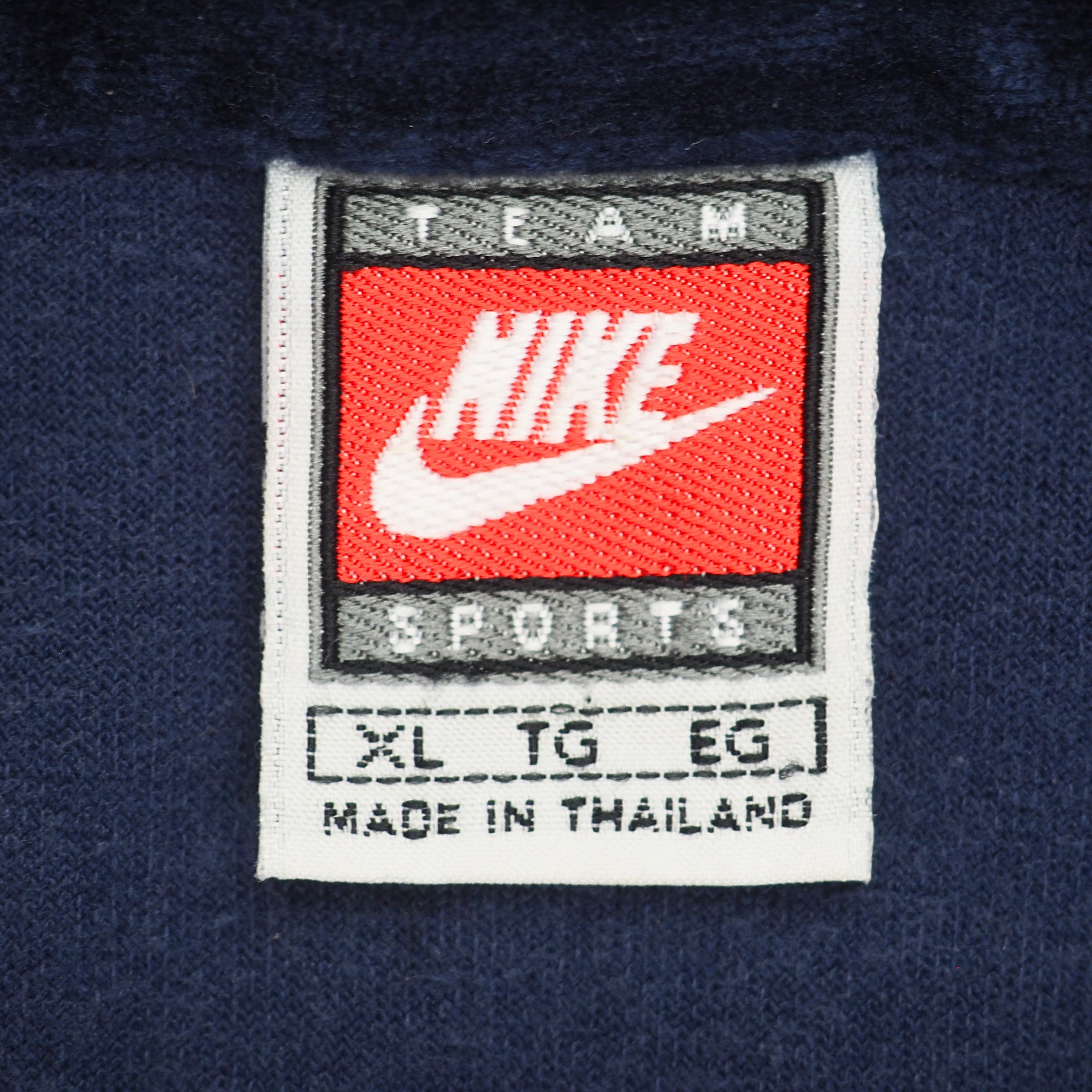 Close up of a vintage Nike Team Sports brand tag