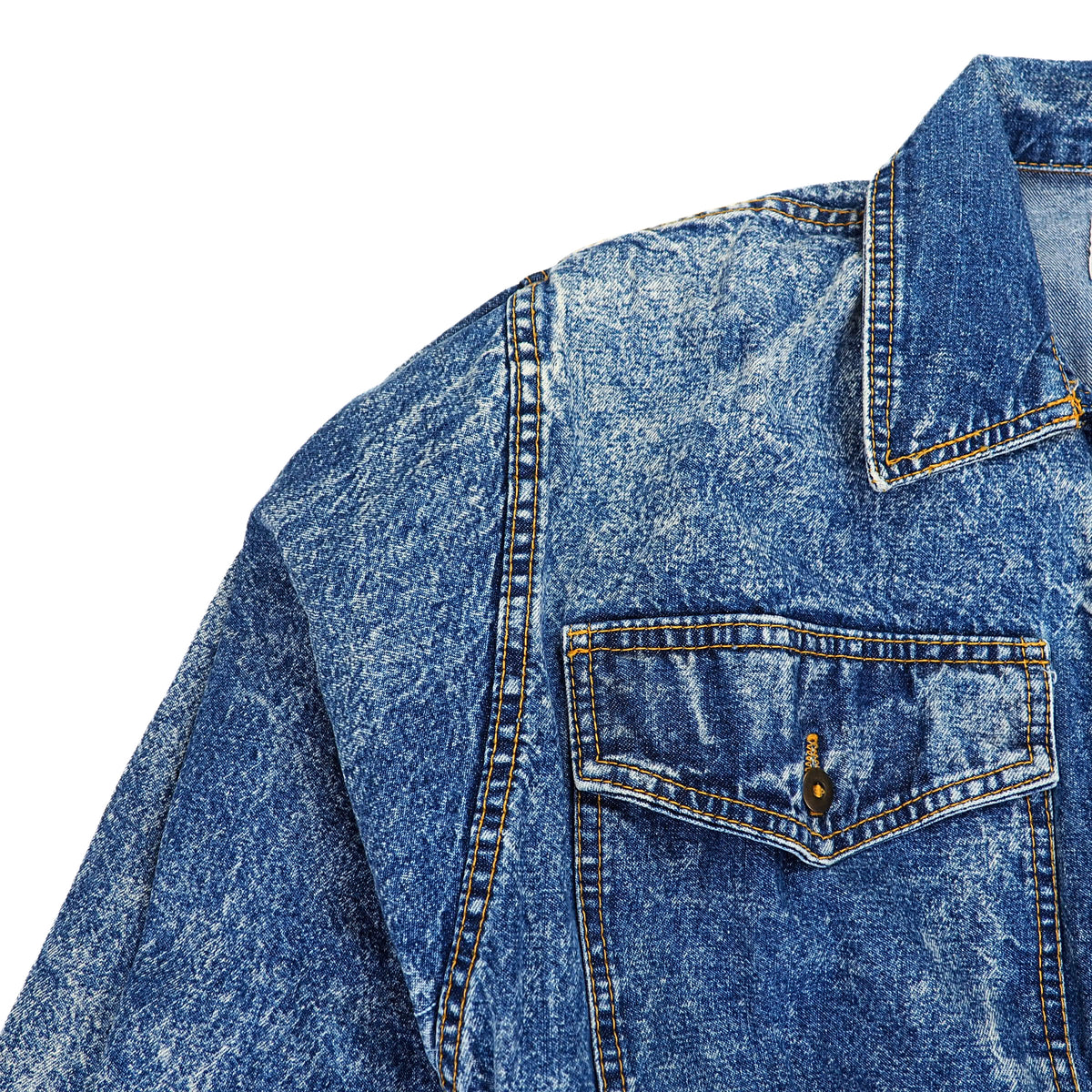 Close-up of a blue acid-wash denim shirt jacket showing the collar, chest pocket, and detailed stitching against a plain white background.