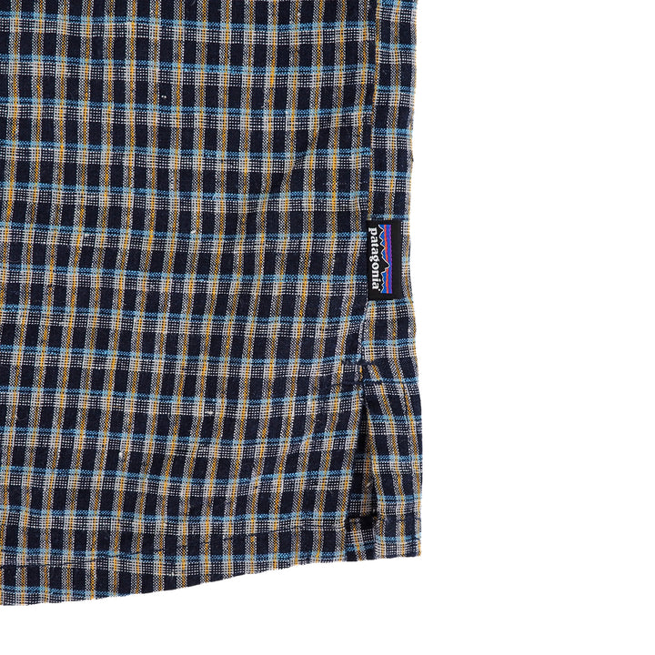 Plaid fabric with a visible Patagonia logo on a white background