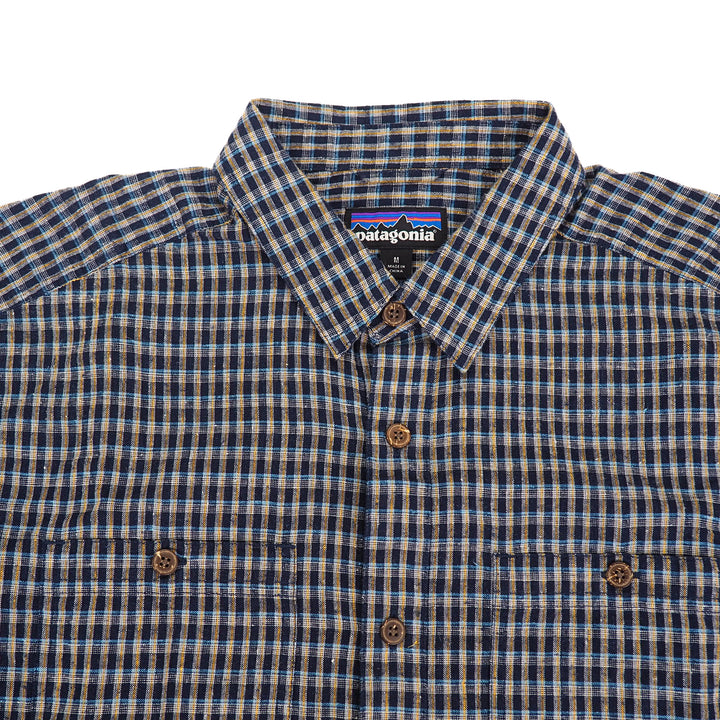 Plaid shirt with Patagonia label on a white background
