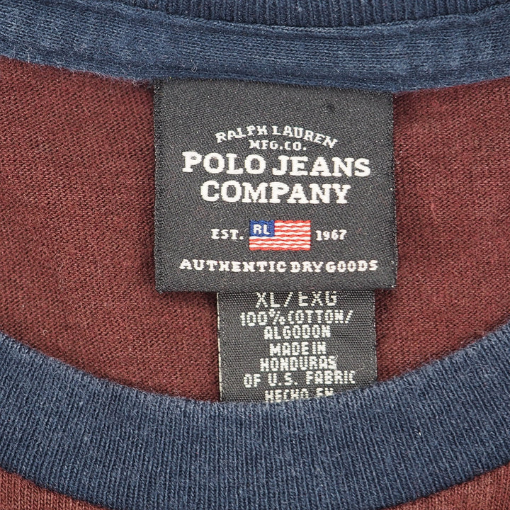 Close-up of a Ralph Lauren Polo Jeans Company neck label on a blue and burgundy colored shirt.